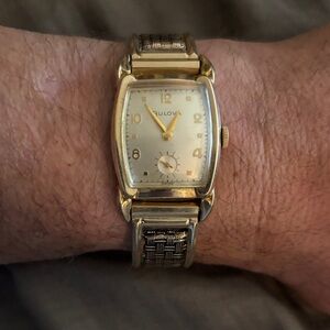 Like New SWISS Made Bulova Gold Watch with second hand at 6:00 o’clock.